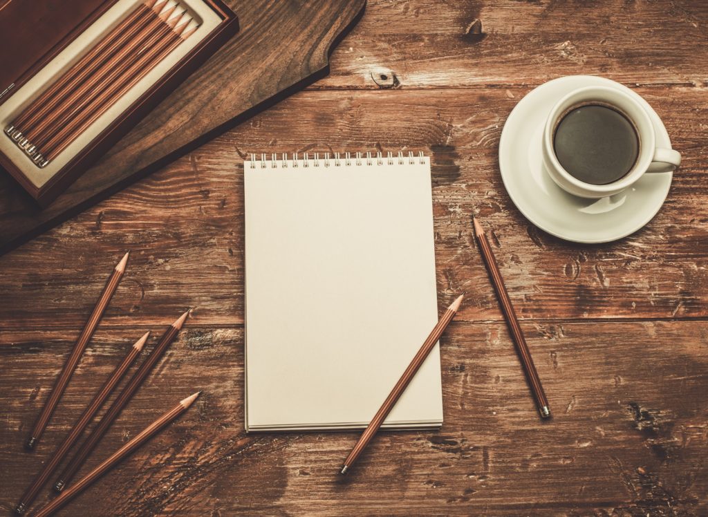Luxurious drawing tools on a wooden table